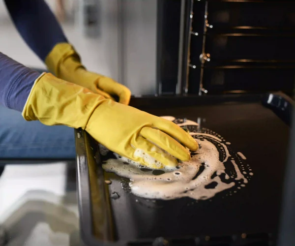 close-up-of-caucasian-woman-cleaning-oven-at-home-2026-01-06-00-52-18-utc