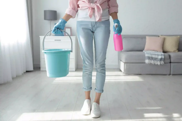 woman-holding-bucket-and-bottle-of-cleaning-produc-2026-01-06-16-27-33-utc (1)